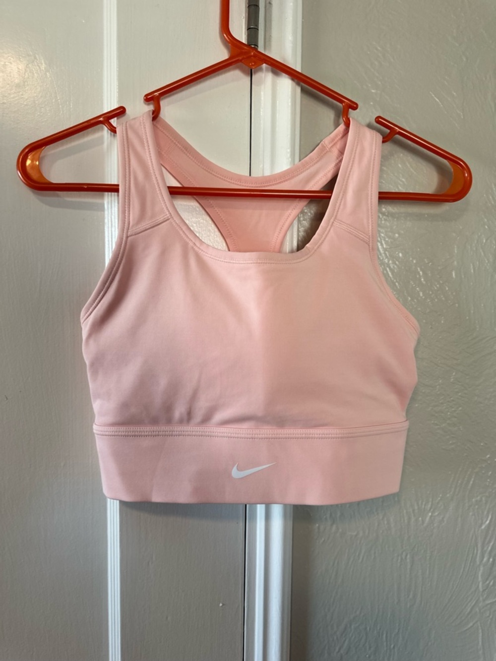 Nike Light Pink Racerback Sports Bra with White Swoosh